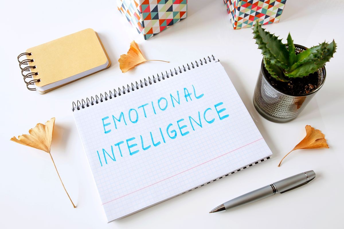 emotional intelligence written in a notebook on white table